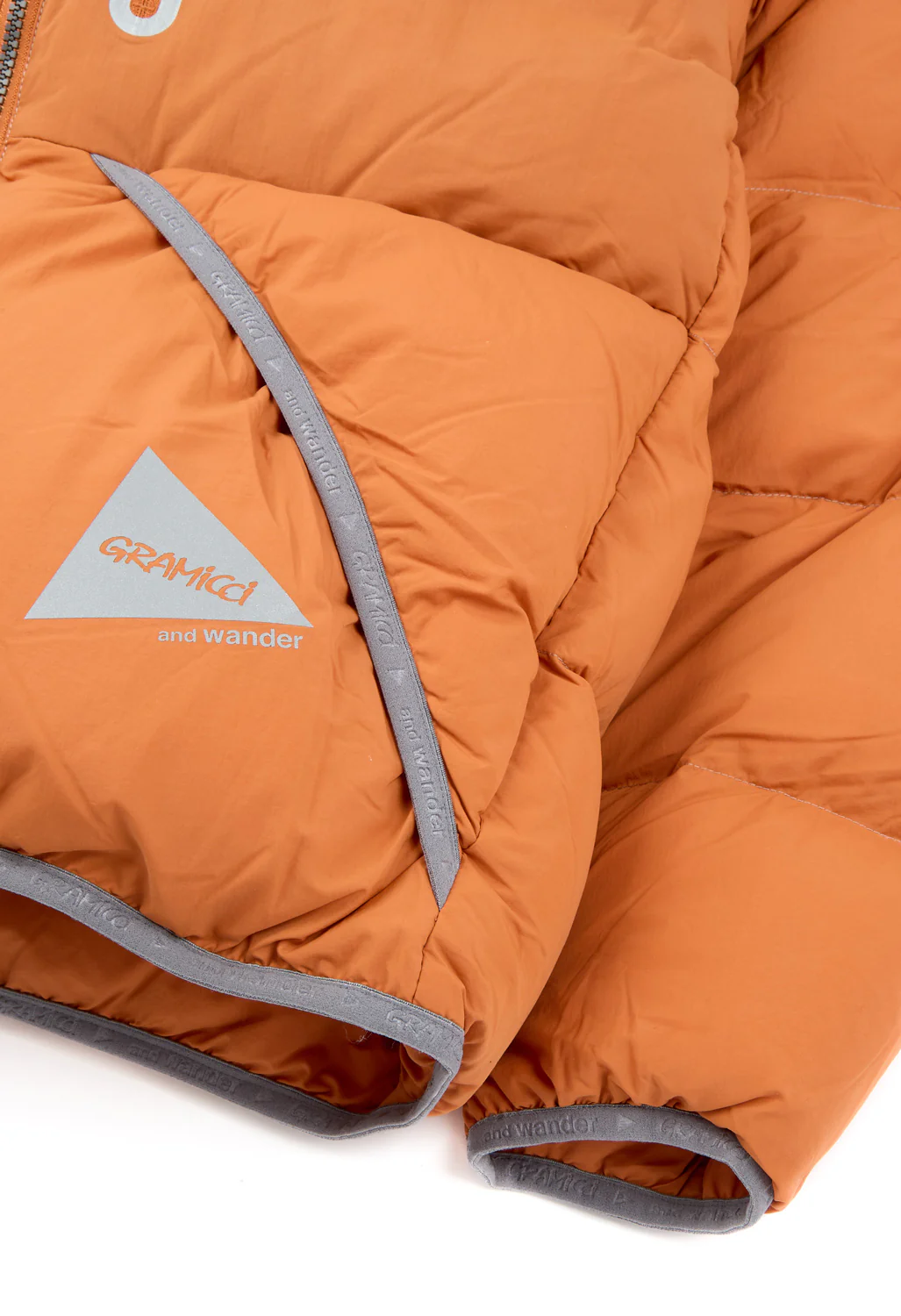 Gramicci x And Wander Down Jacket - ORANGE - Image 6